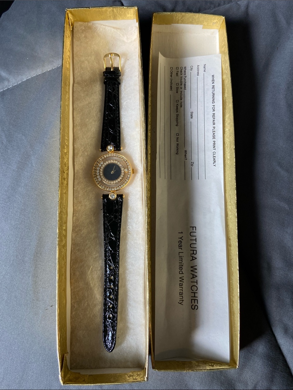 Futura Watches Ladies Gold Tone Crystal Dial Watch with Black Strap